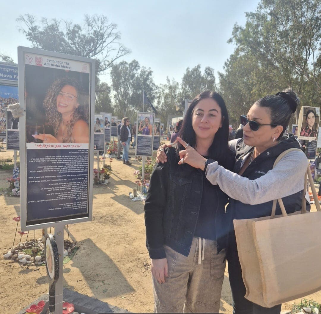Ahuva and visitor at Adi’s memorial pillar