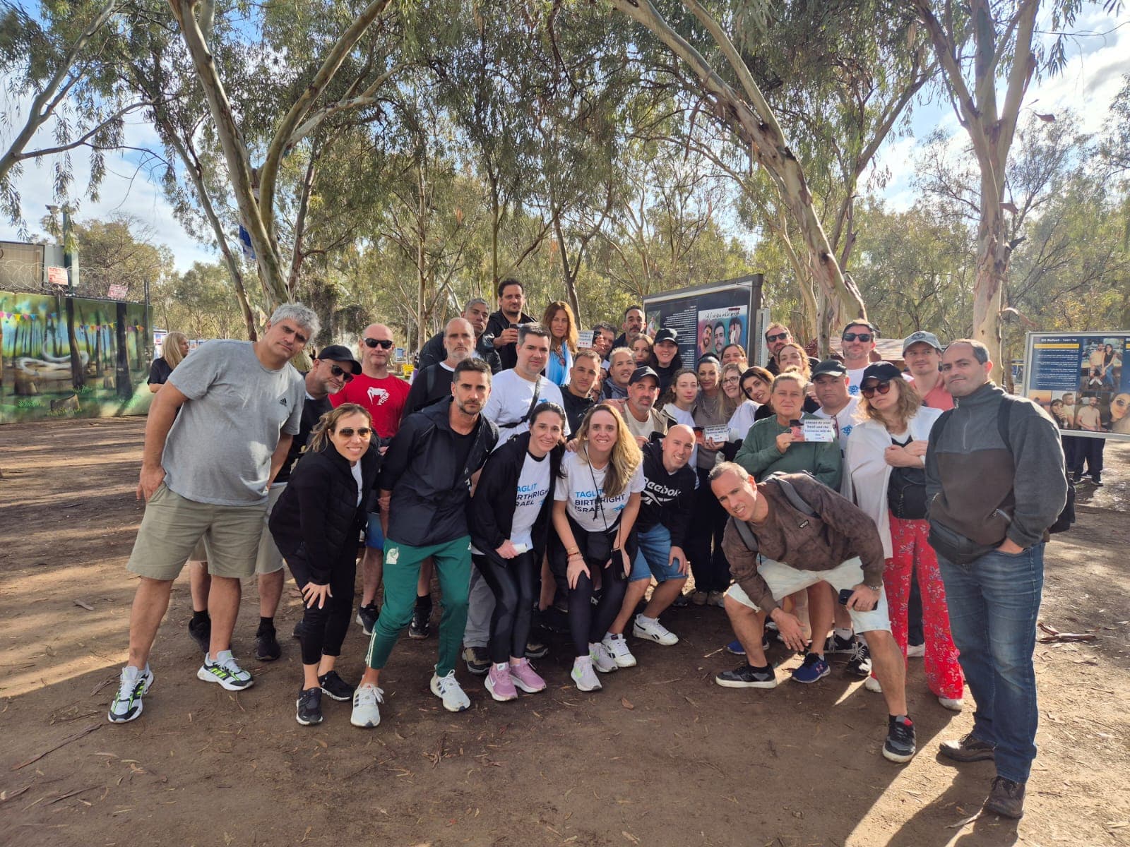 Large tour group at the memorial site entrance